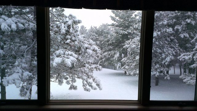 view-of-snowing-from-back-picture-window-including-window